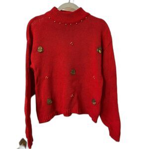 Red mock-neck sweater with coin embellishments